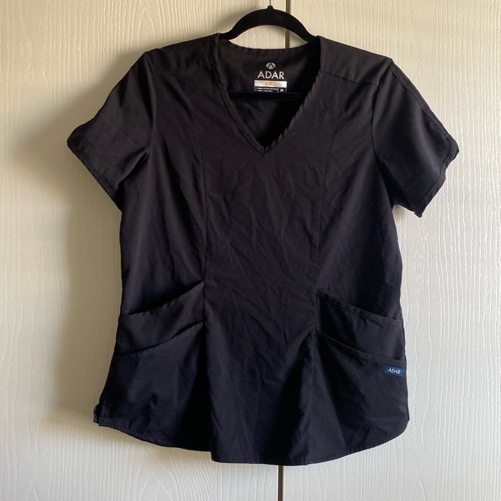 This is a Medium Black short sleeve crop top. Never worn.